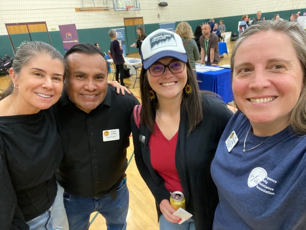 Nicole poses with volunteers and staff from EFFA and the Boulder Valley School District.